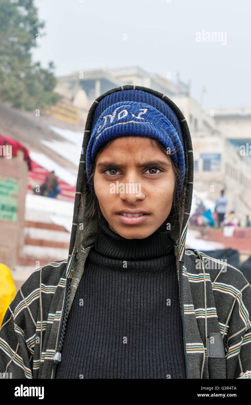 Unidentified Indian young girl on the Ghat in Varanasi. Uttar Pradesh, India Stock Photo