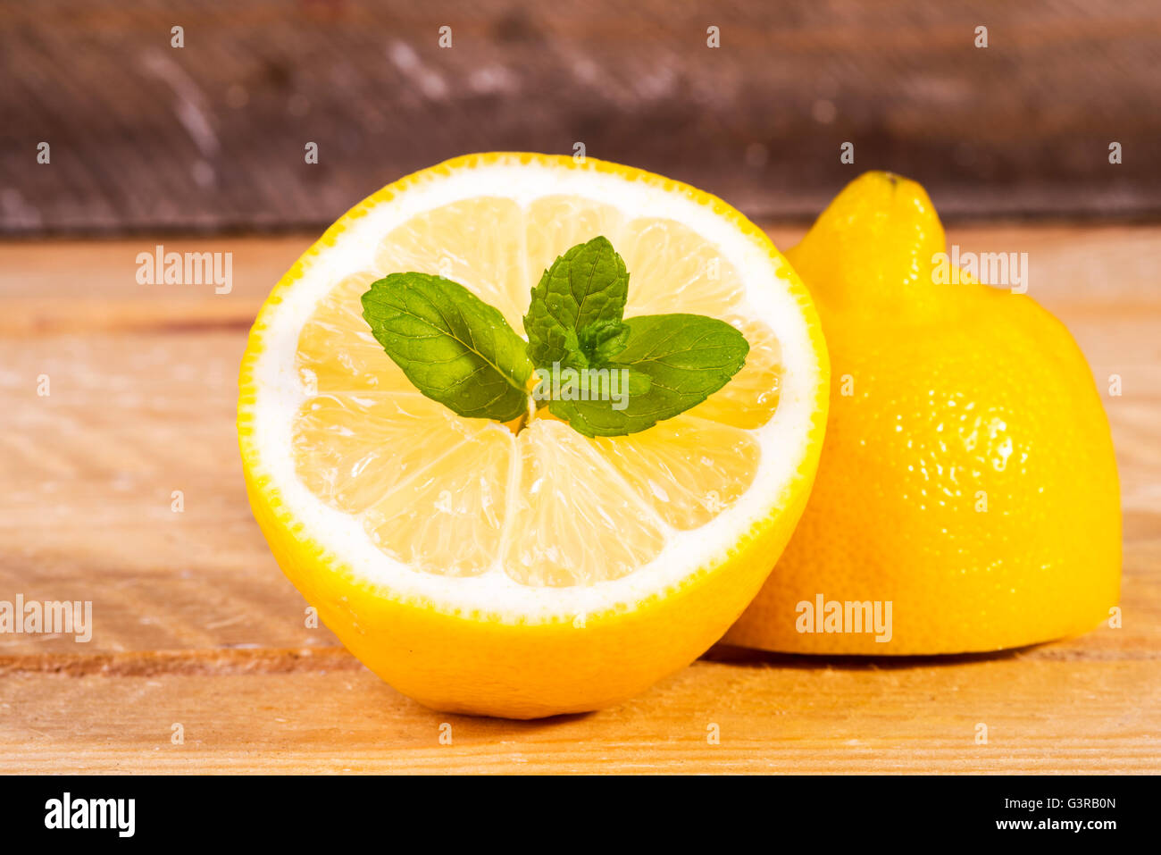 photo of half a lemon with fresh mint Stock Photo