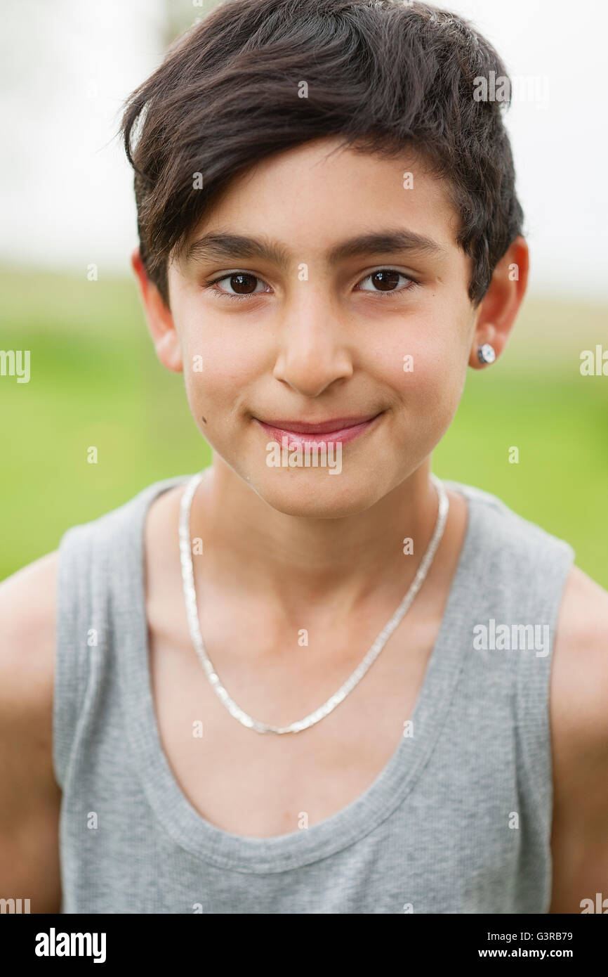 Sweden, Varmland, Filipstad, Gasborn, Horrsjon, Portrait of boy (10-11)  with earring and necklace Stock Photo - Alamy