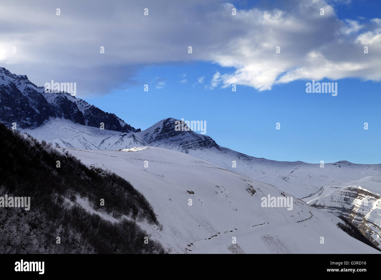Winter mountains at sun evening. Greater Caucasus, Mount Shahdagh. Qusar rayon of Azerbaijan. Stock Photo