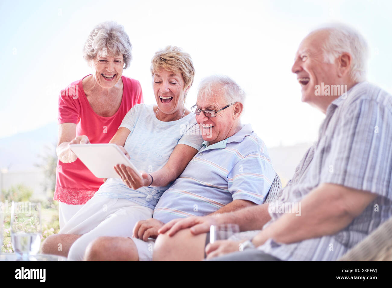 Senior adults using digital tablet Stock Photo