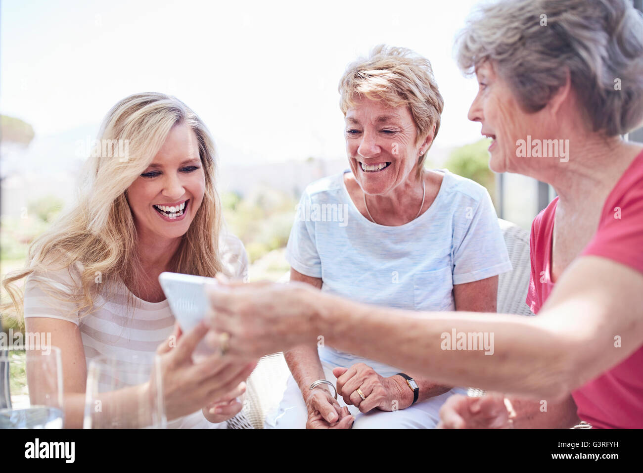 Senior women using cell phone Stock Photo
