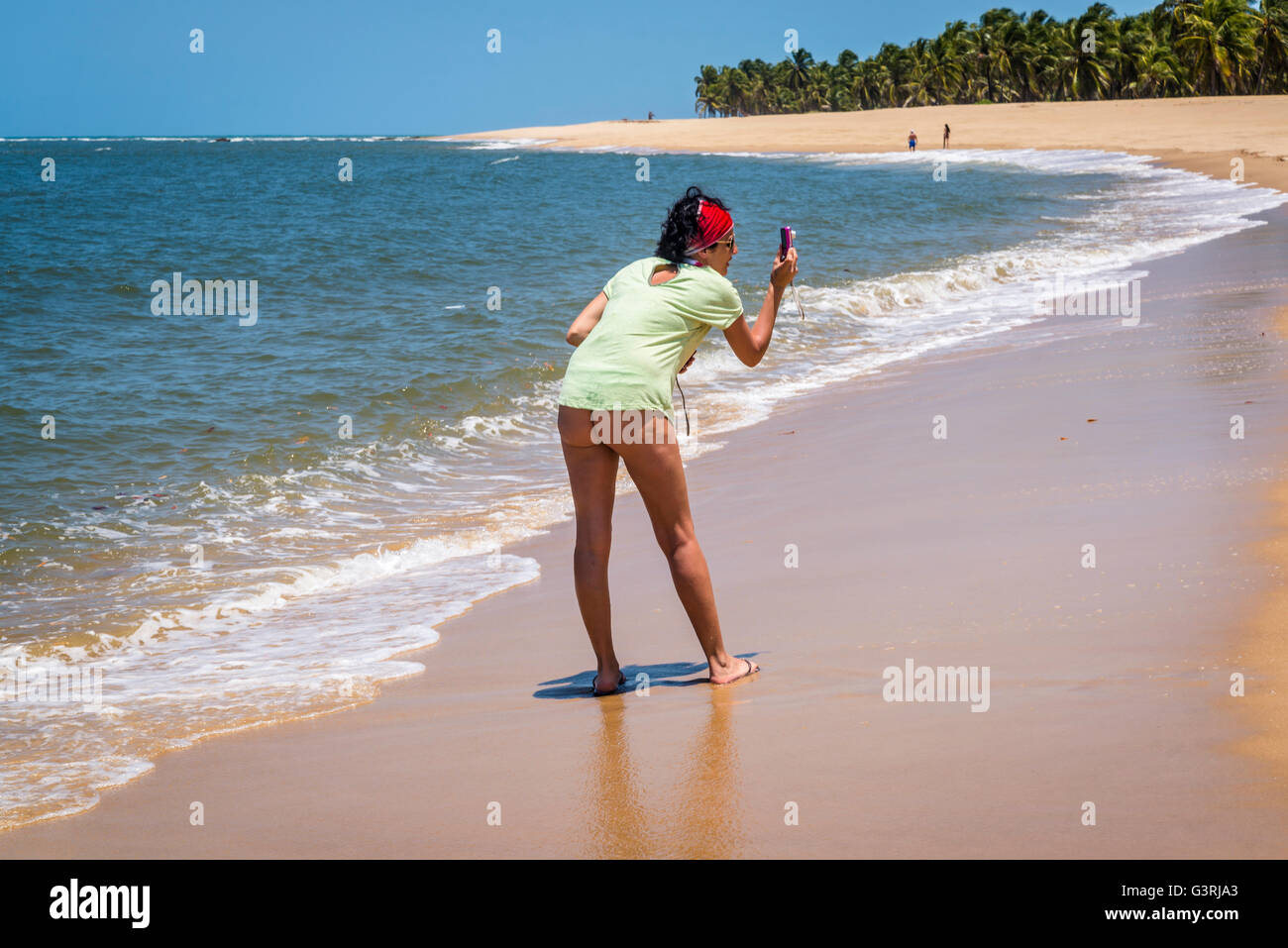 Woman taking a photo, Gunga Beach, Maceio, Alagoas, Stock Photo