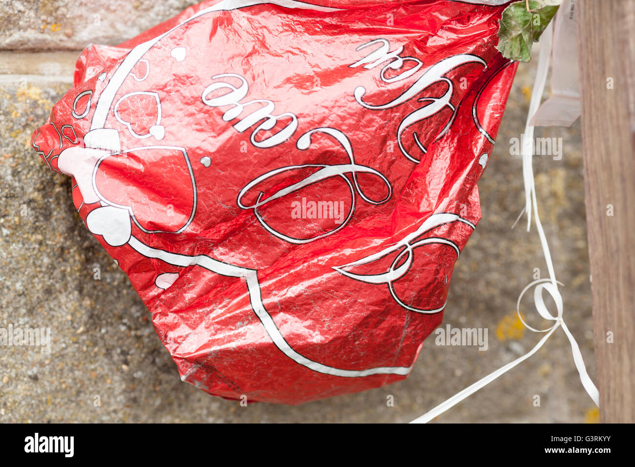 Deflated love heart balloon Stock Photo