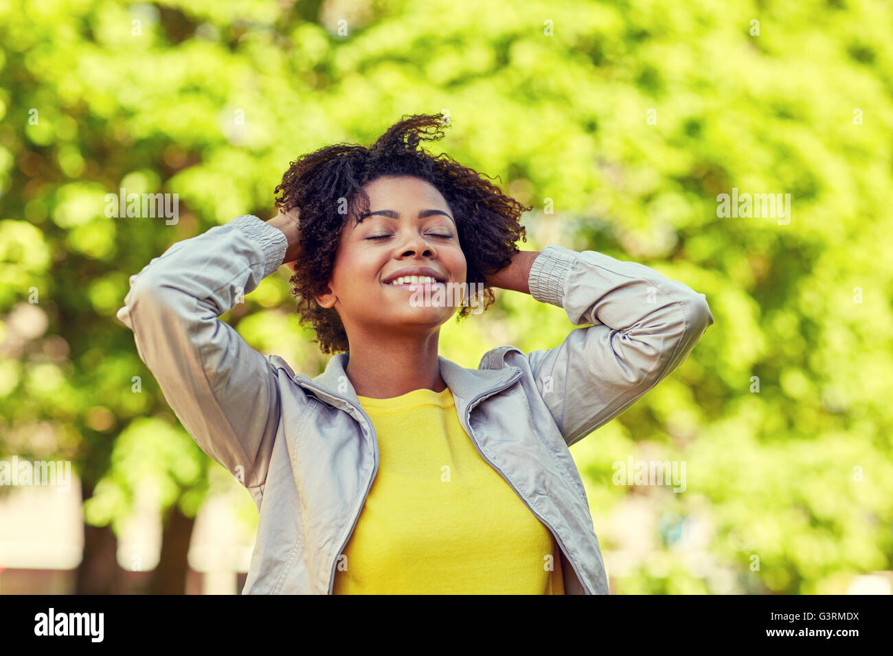happy african american young woman in summer park Stock Photo - Alamy