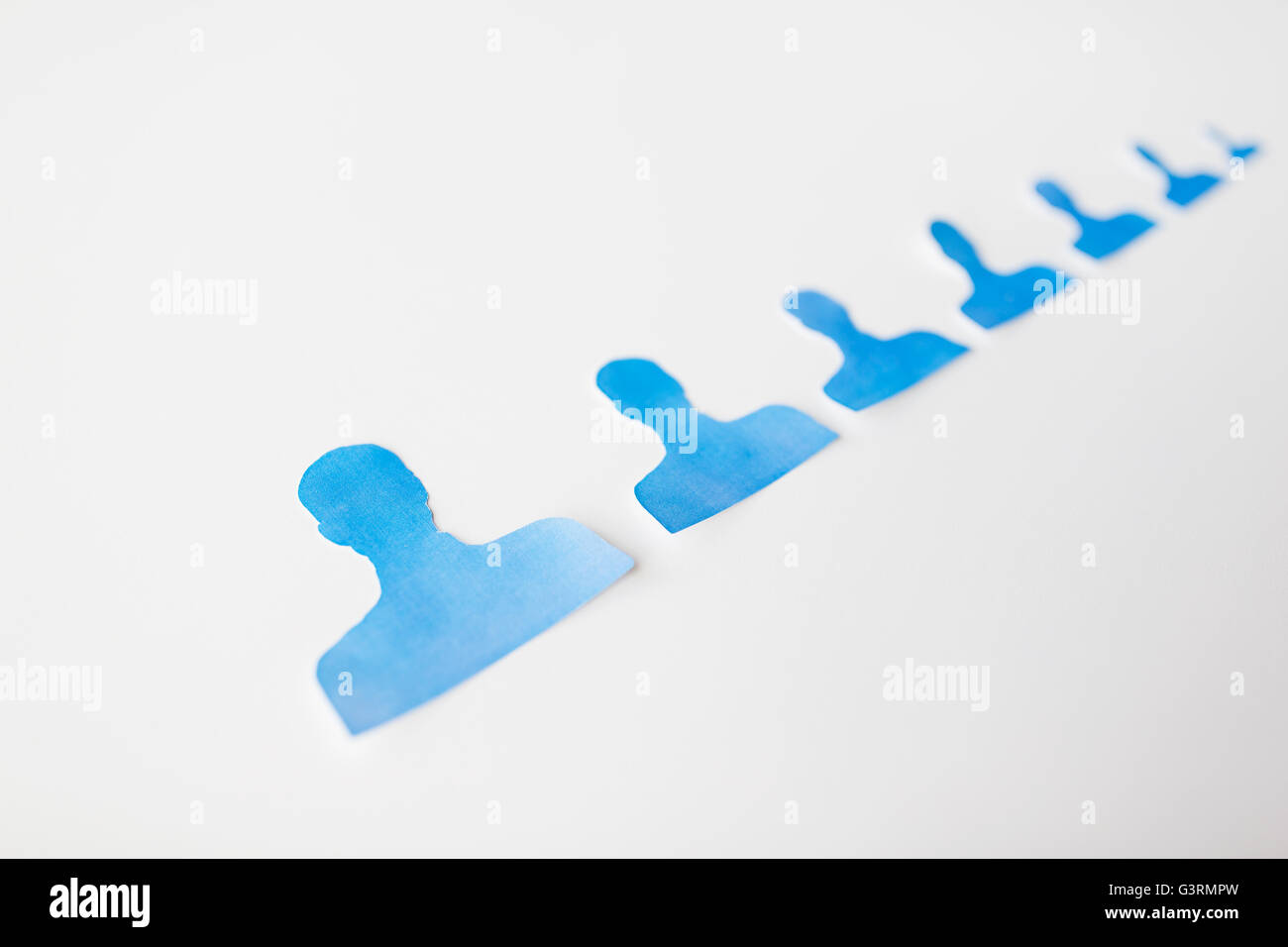 Human File Paper close up of paper human shapes on white board Stock Photo - Alamy