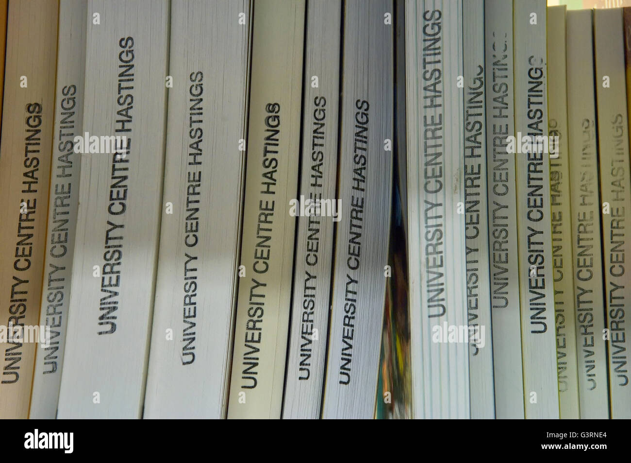 University Centre Hastings library books on a bookcase shelf Stock