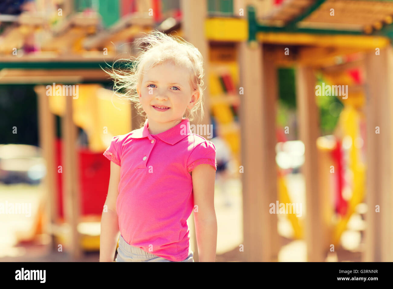 happy little girl on children playground Stock Photo - Alamy