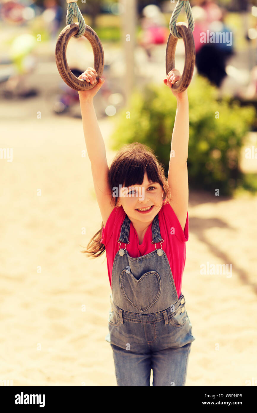 happy little girl on children playground Stock Photo - Alamy