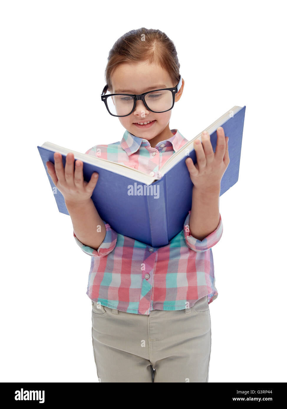 happy little girl in eyeglasses reading book Stock Photo Alamy
