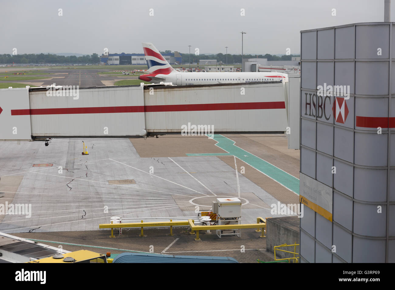 British Airways plane at the jet bridge at London Gatwick airport Stock