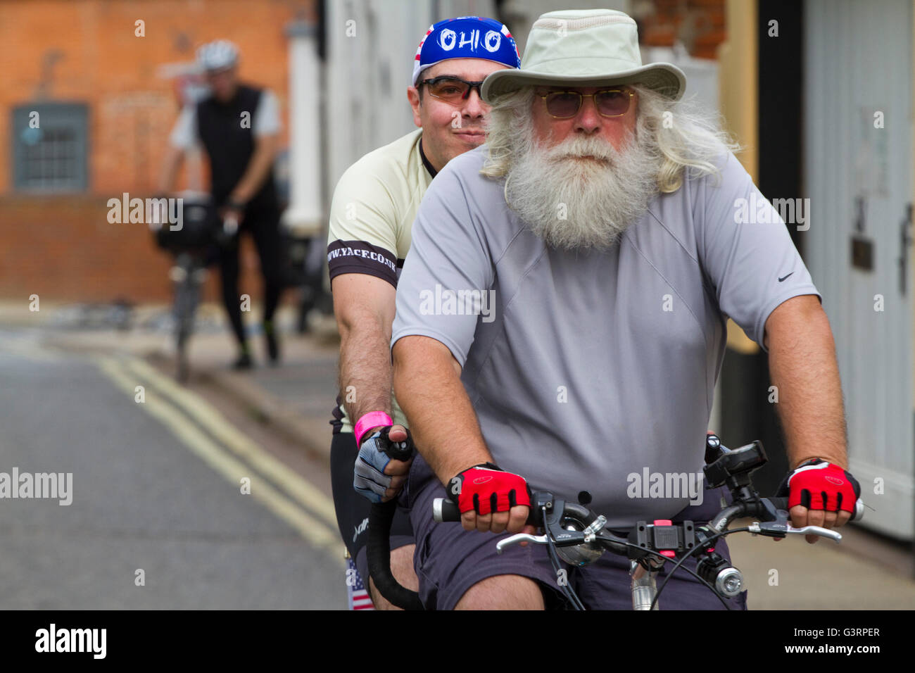 Older man with a huge white beard piloting a tandem Stock Photo