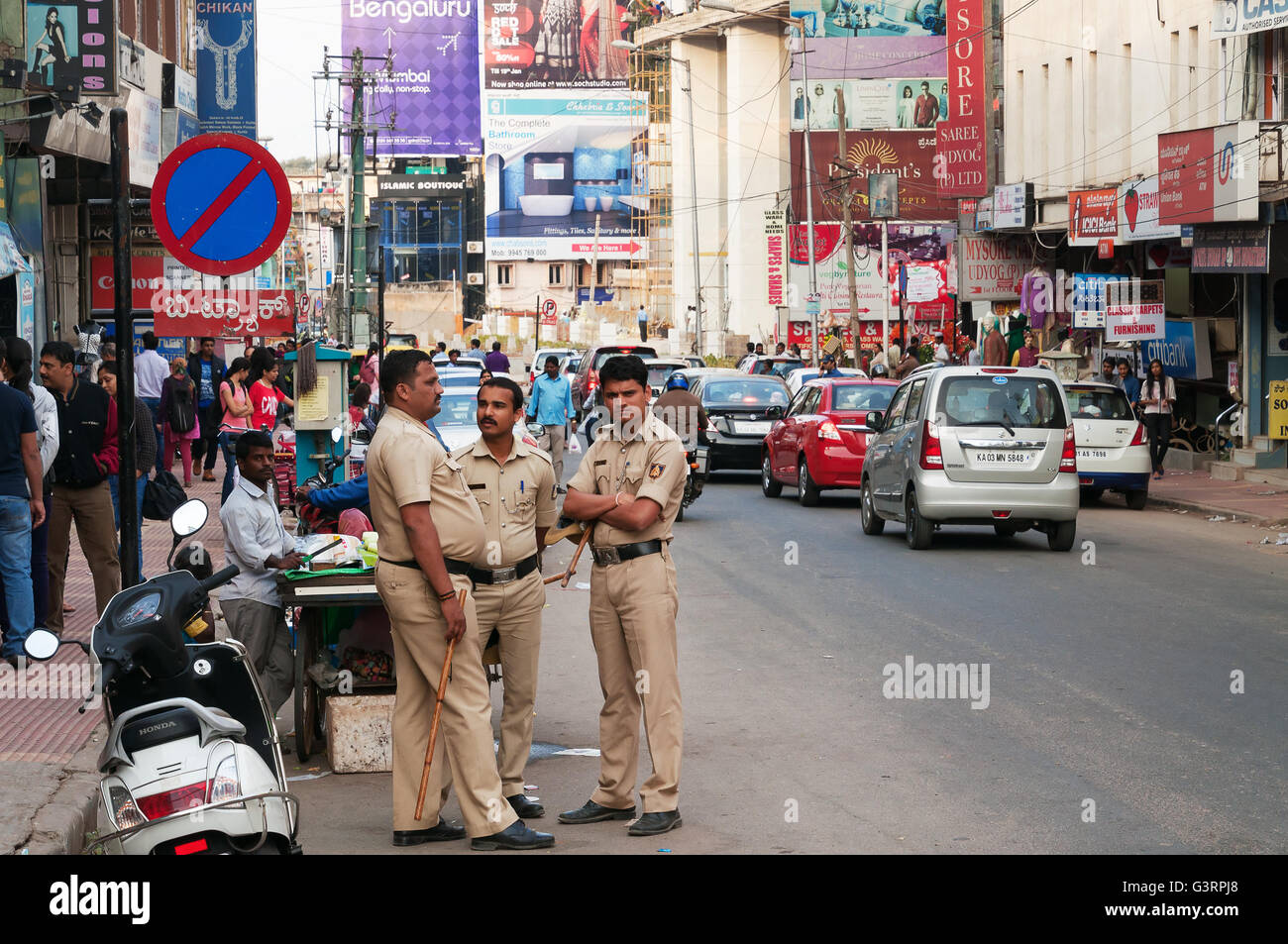 Policemen on Commercial street. Commercial street in Bangalore is one of the main shopping comp Stock Photo