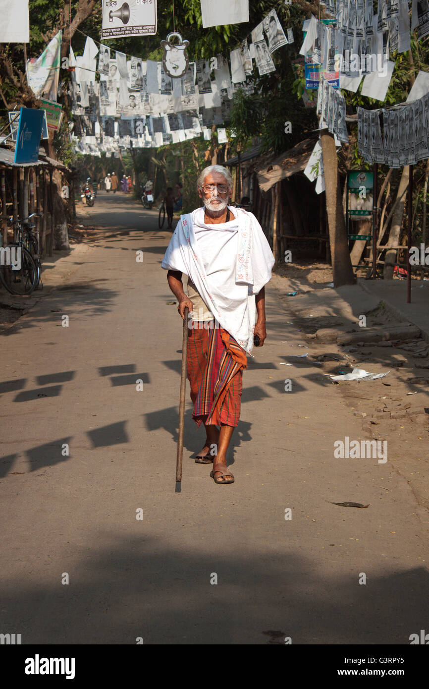 A old man on walk by road. Stock Photo