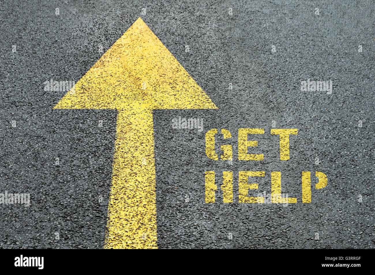 Yellow forward road sign with Get Help word on the asphalt road. Human ...