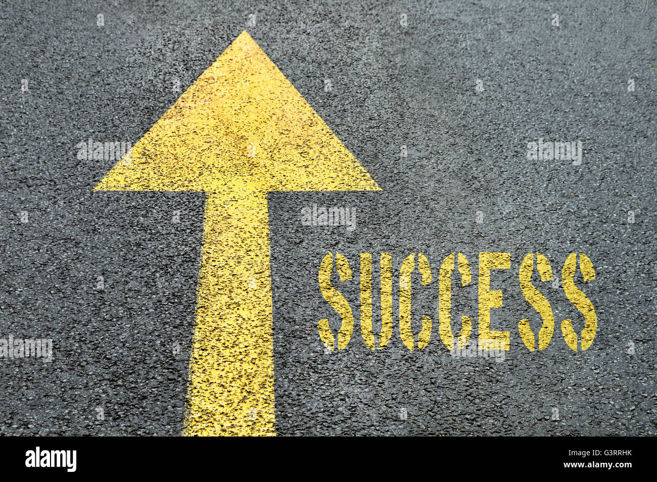 Yellow forward road sign with Success word on the asphalt road. Business concept. Stock Photo