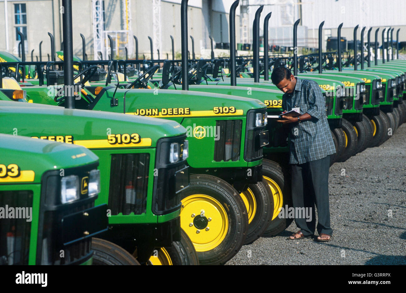 INDIA, Pune, American multinational John Deere and L&T joint venture tractor factory, production of John Deere tractor 5103 for the indian market and for export to africa and asia Stock Photo