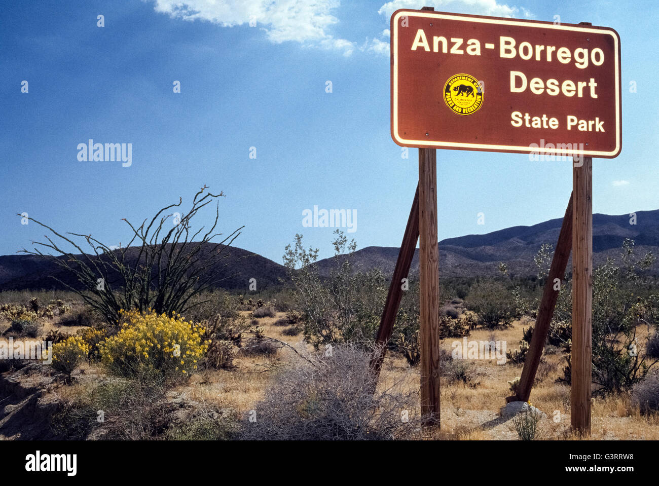 A sign welcomes visitors to Anza-Borrego Desert State Park spreads over one-fifth of San Diego County and is the largest state park in California, USA. It covers 600,000 acres (240,000 hectares) of the Colorado Desert and also reaches into Imperial and Riverside counties. The vast park is home to a host of birds, reptiles and other animals, including desert bighorn sheep. Roads and hiking trails lead visitors through spectacular displays of desert plants that are highlighted with wildflowers in springtime. Stock Photo