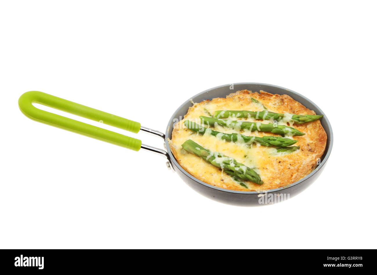 Individual asparagus and cheese Frittata in a pan isolated against white Stock Photo