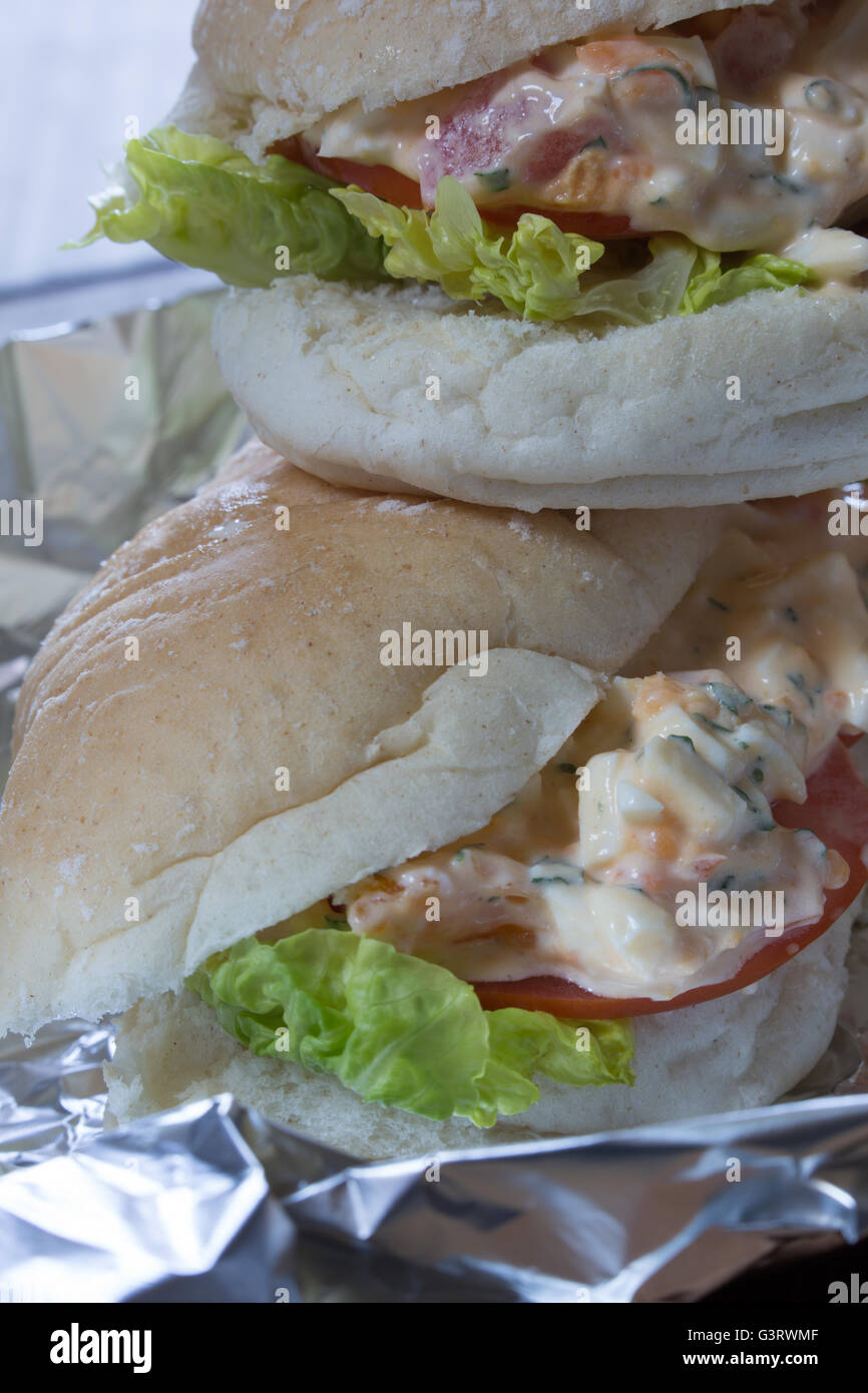 Seaside Sandwich, A classic northern English treat of boiled egg, chopped tomato and mayonnaise as a snack for the beach. Stock Photo