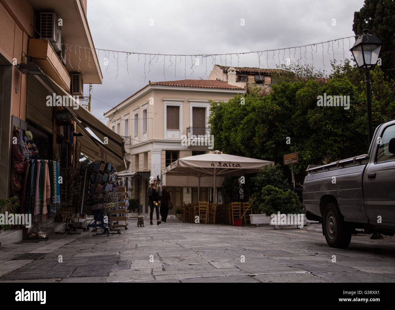 Walking through a street in Plaka, central Athens, on a cloudy day. Stock Photo