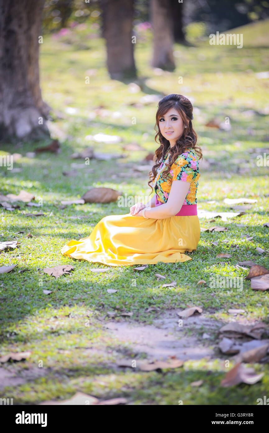 asia beautiful girl in the yellow dress on nature Stock Photo - Alamy