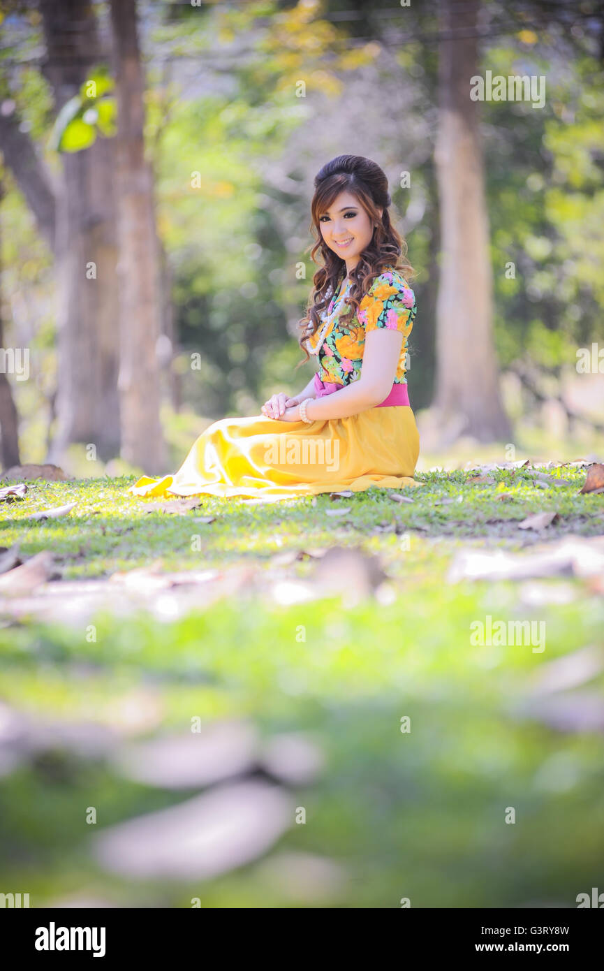 asia beautiful girl in the yellow dress on nature Stock Photo - Alamy