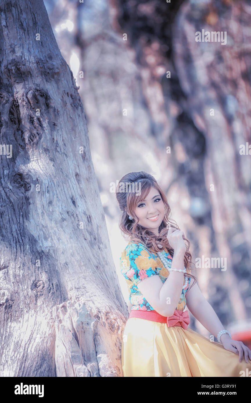 asia beautiful girl in the yellow dress on nature Stock Photo - Alamy