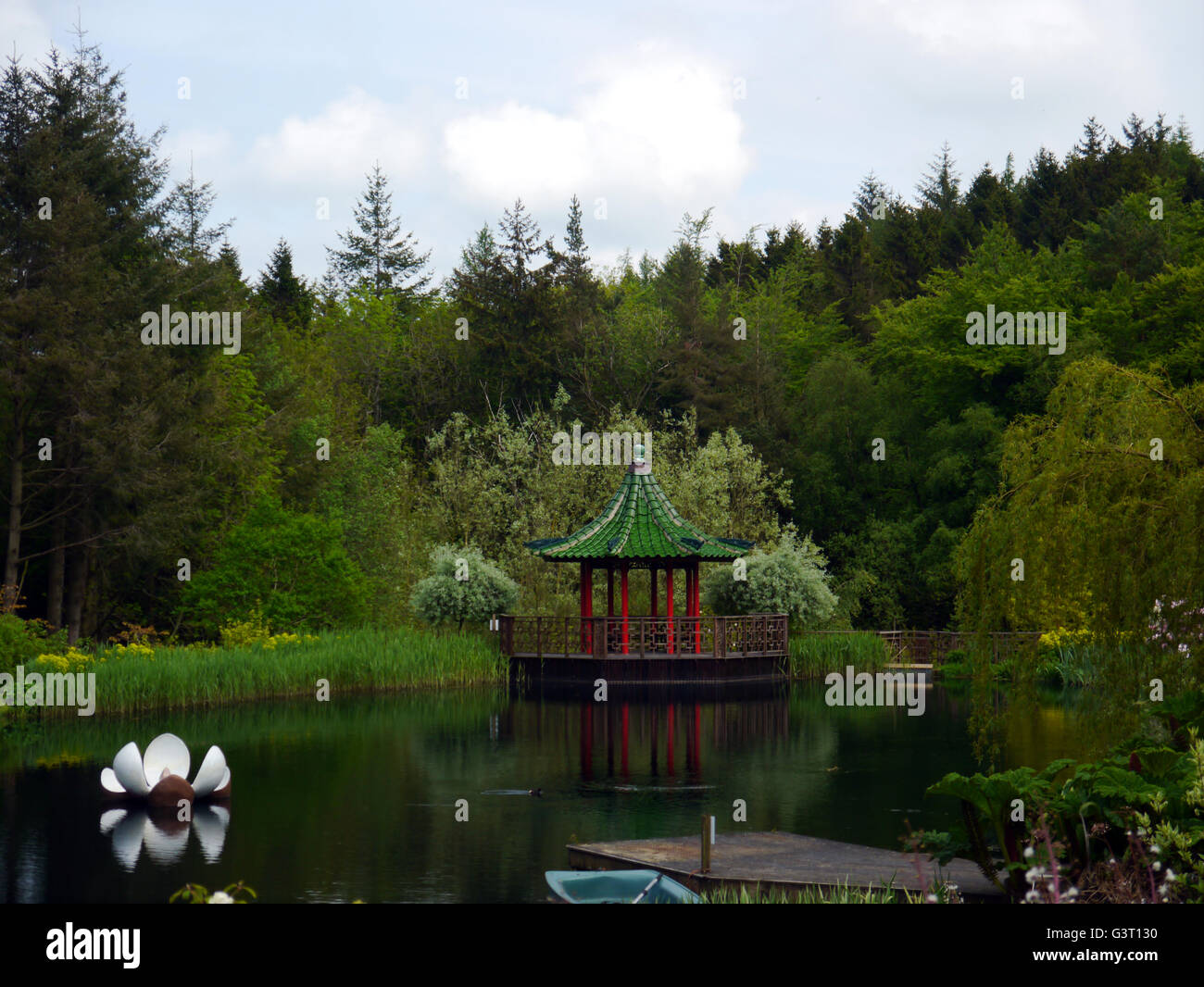 Floating Sculpture and Pagoda on the Lake at the Himalayan Garden & Sculpture Park, North Yorkshire, England UK. Stock Photo