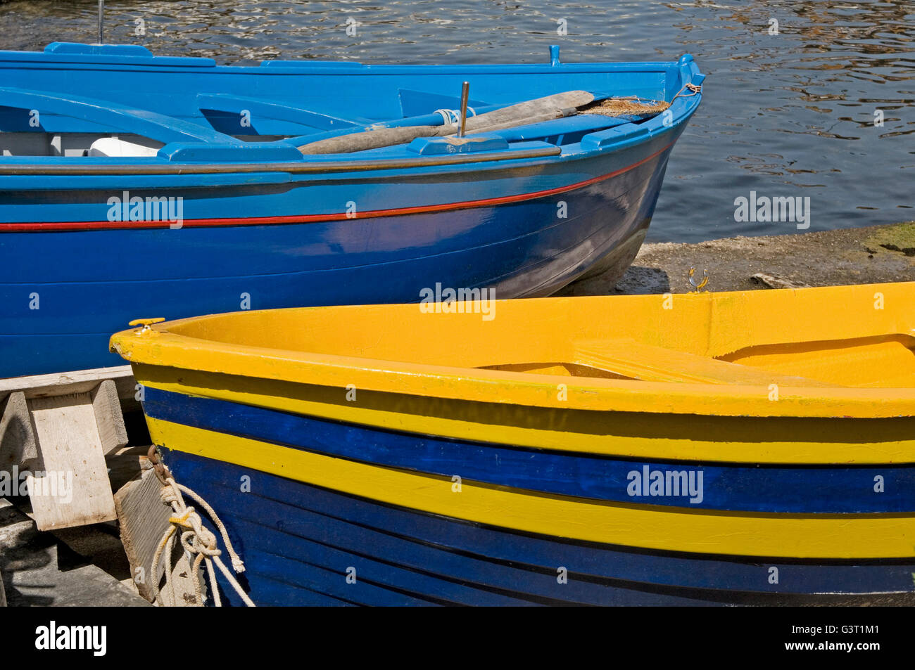 Two vibrantly coloured boats at Sorrento, near Naples, Italy Stock Photo