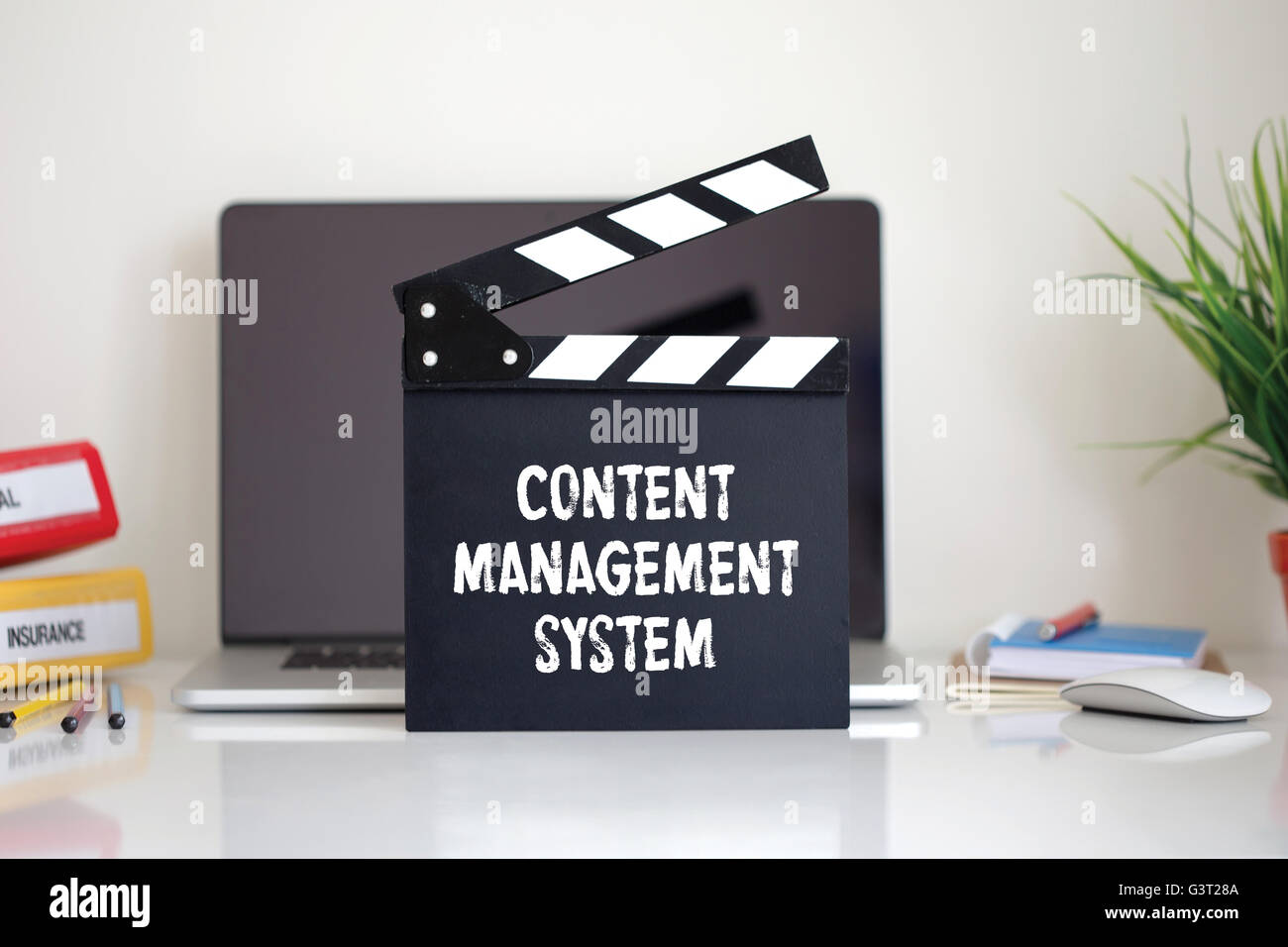 Cinema Clapper with Content Management System word Stock Photo