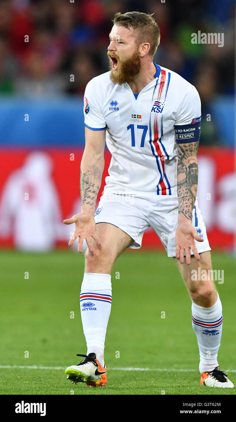 Saint-Etienne, France. 14th June, 2016. Aron Gunnarsson of Iceland reacts during the UEFA Euro 2016 Group F soccer match Portugal vs. Iceland at Stade Geoffroy Guichard in Saint-Etienne, France, 14 June 2016. Photo: Uwe Anspach/dpa/Alamy Live News Stock Photo