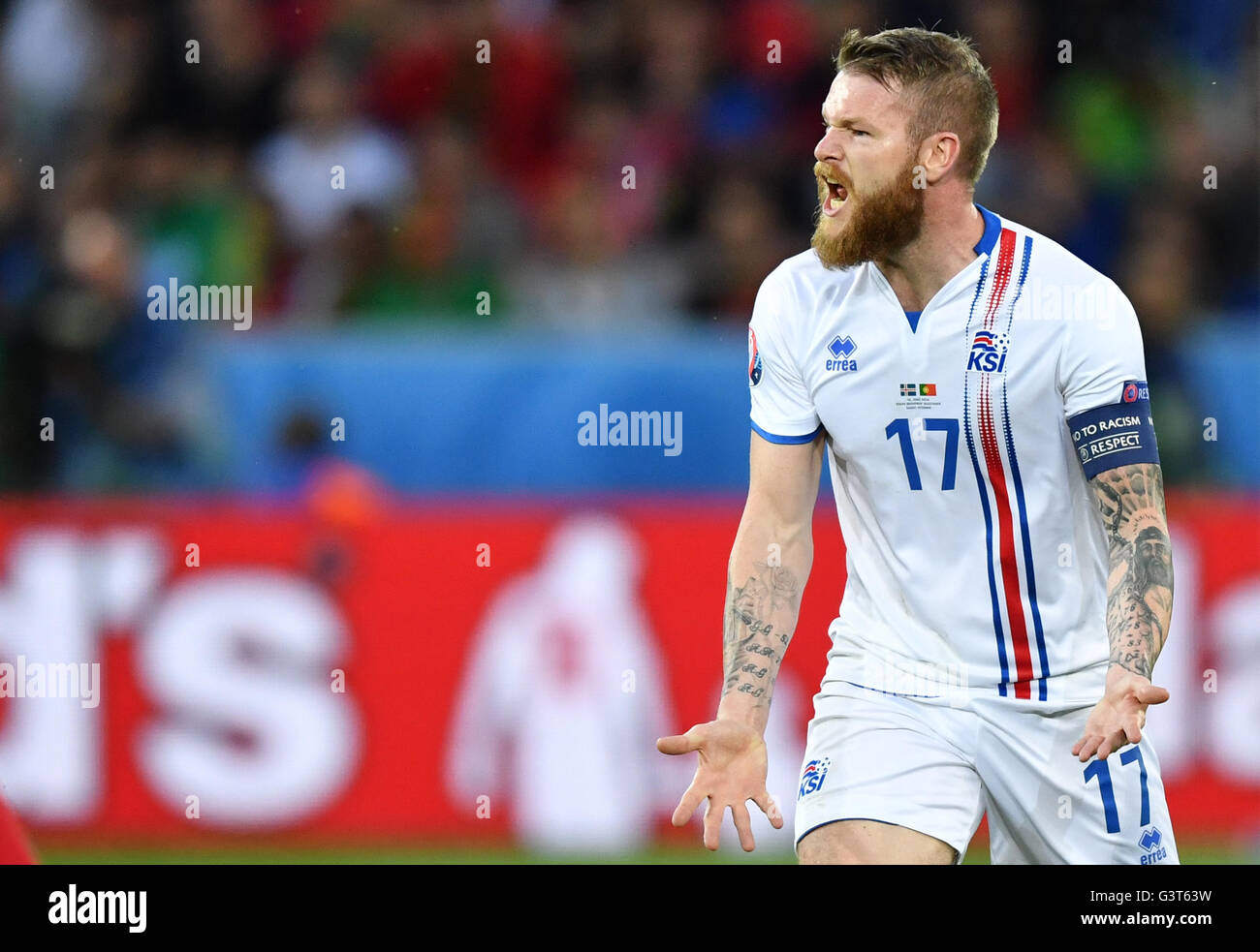 Saint-Etienne, France. 14th June, 2016. Aron Gunnarsson of Iceland gestures during the UEFA Euro 2016 Group F soccer match Portugal vs. Iceland at Stade Geoffroy Guichard in Saint-Etienne, France, 14 June 2016. Photo: Uwe Anspach/dpa/Alamy Live News Stock Photo