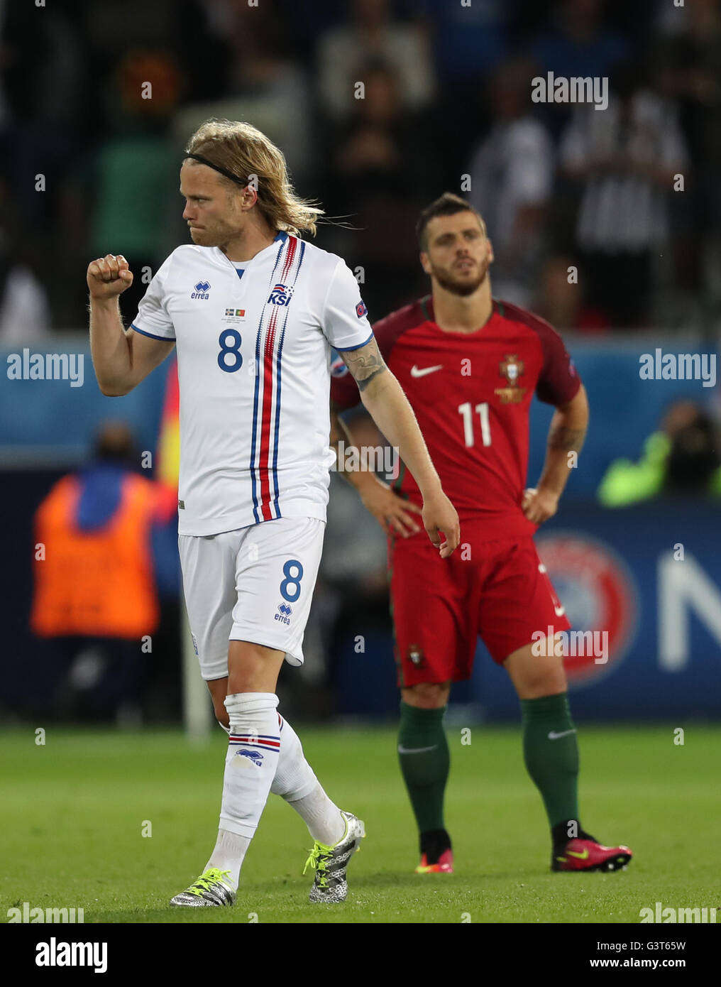 Saint Etienne, France. 14th June, 2016. Birkir Bjarnason (L) of Iceland celebrates after scoring during the Euro 2016 Group F soccer match between Portugal and Iceland in Saint-Etienne, France, June 14, 2016. Credit:  Xinhua/Alamy Live News Stock Photo
