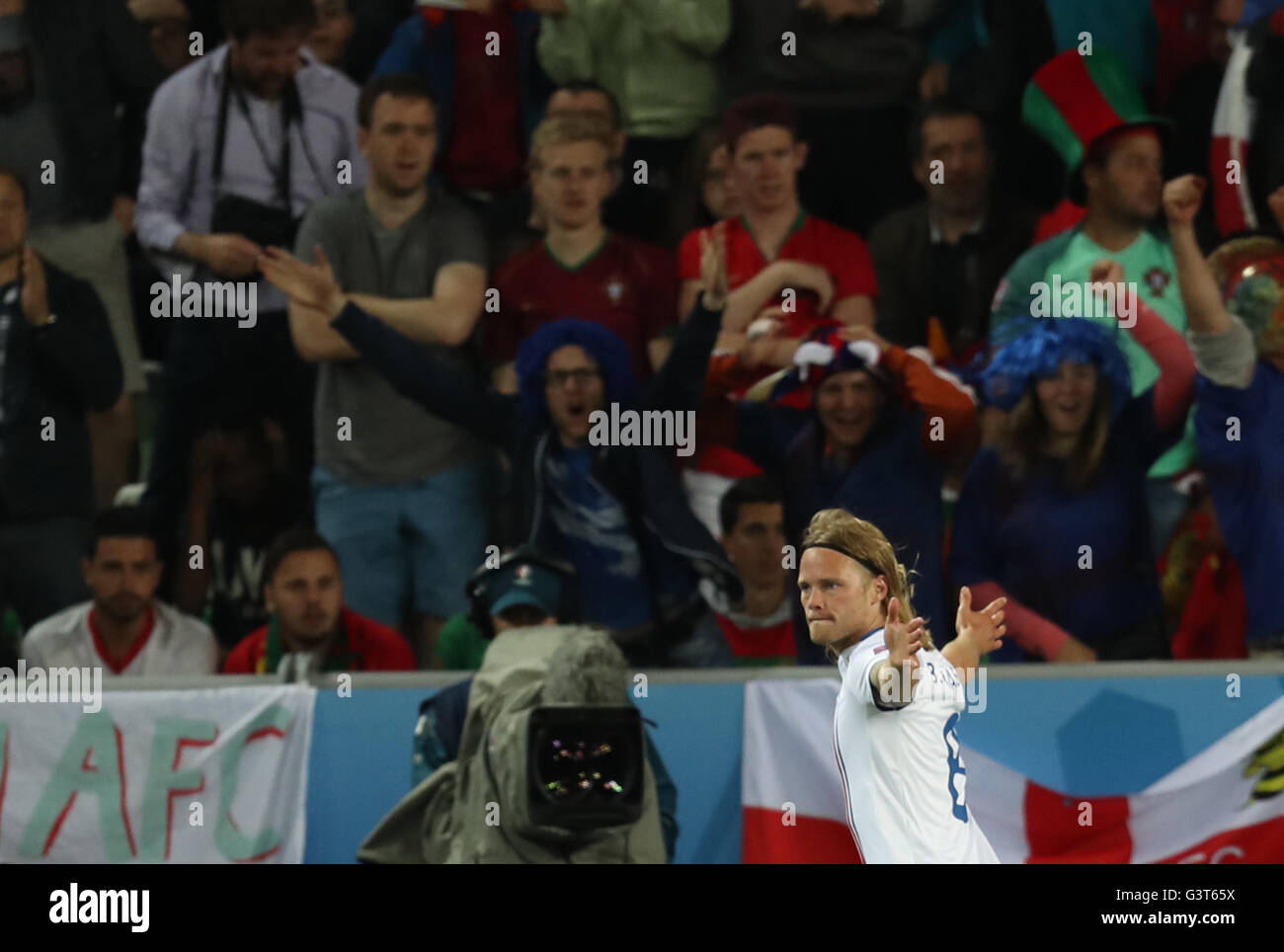 Saint Etienne, France. 14th June, 2016. Birkir Bjarnason of Iceland celebrates after scoring during the Euro 2016 Group F soccer match between Portugal and Iceland in Saint-Etienne, France, June 14, 2016. Credit:  Xinhua/Alamy Live News Stock Photo