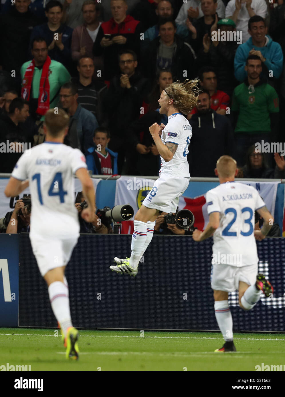 Saint Etienne, France. 14th June, 2016. Birkir Bjarnason (C) of Iceland celebrates after scoring during the Euro 2016 Group F soccer match between Portugal and Iceland in Saint-Etienne, France, June 14, 2016. Credit:  Xinhua/Alamy Live News Stock Photo