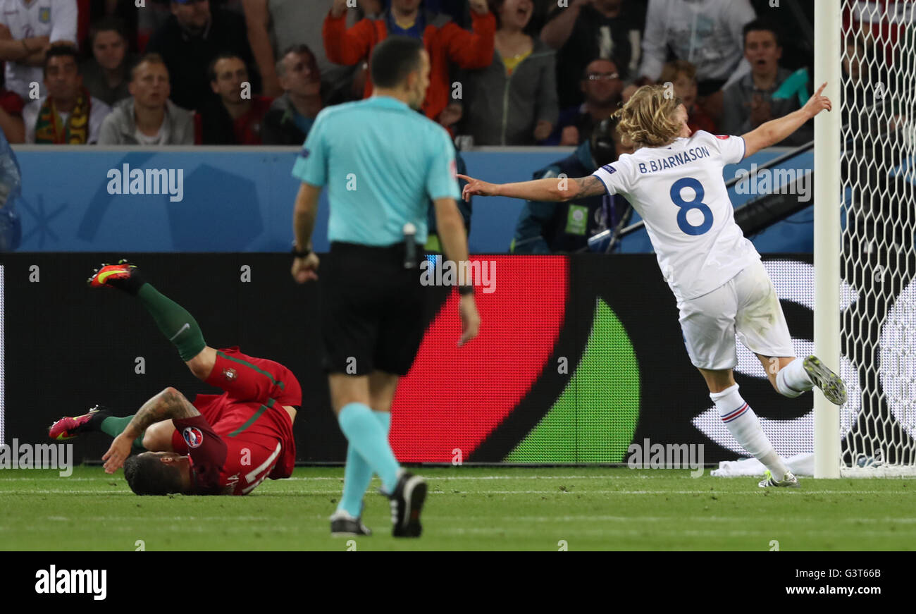 Saint Etienne, France. 14th June, 2016. Birkir Bjarnason (R) of Iceland celebrates after scoring during the Euro 2016 Group F soccer match between Portugal and Iceland in Saint-Etienne, France, June 14, 2016. Credit:  Xinhua/Alamy Live News Stock Photo
