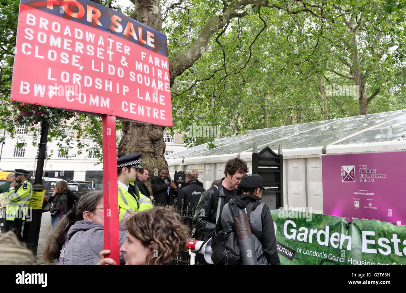 Mayfair, London, UK. 14th June 2016. Anarchist group Class War together with the Revolutionary Communist Group and other housing activists stage a noise demonstration at the entrance to the London Real Estate Forum to protest the sell-off by London local authorities of their land and council estates to property developers. Credit:  Denis McWilliams/Alamy Live News Stock Photo