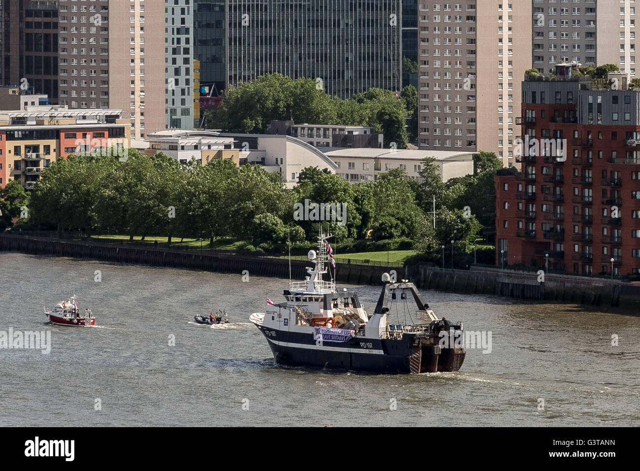 London, UK. 15th June, 2016. Flotilla of British fishermen led by UKIP leader Nigel Farage passes Canary Wharf business park buildings. The flotilla was launched early morning from Southend-on-Sea to highlight the plight of British fishermen and the continued to campaign for Britain to leave the European Union (EU) Credit:  Guy Corbishley/Alamy Live News Stock Photo