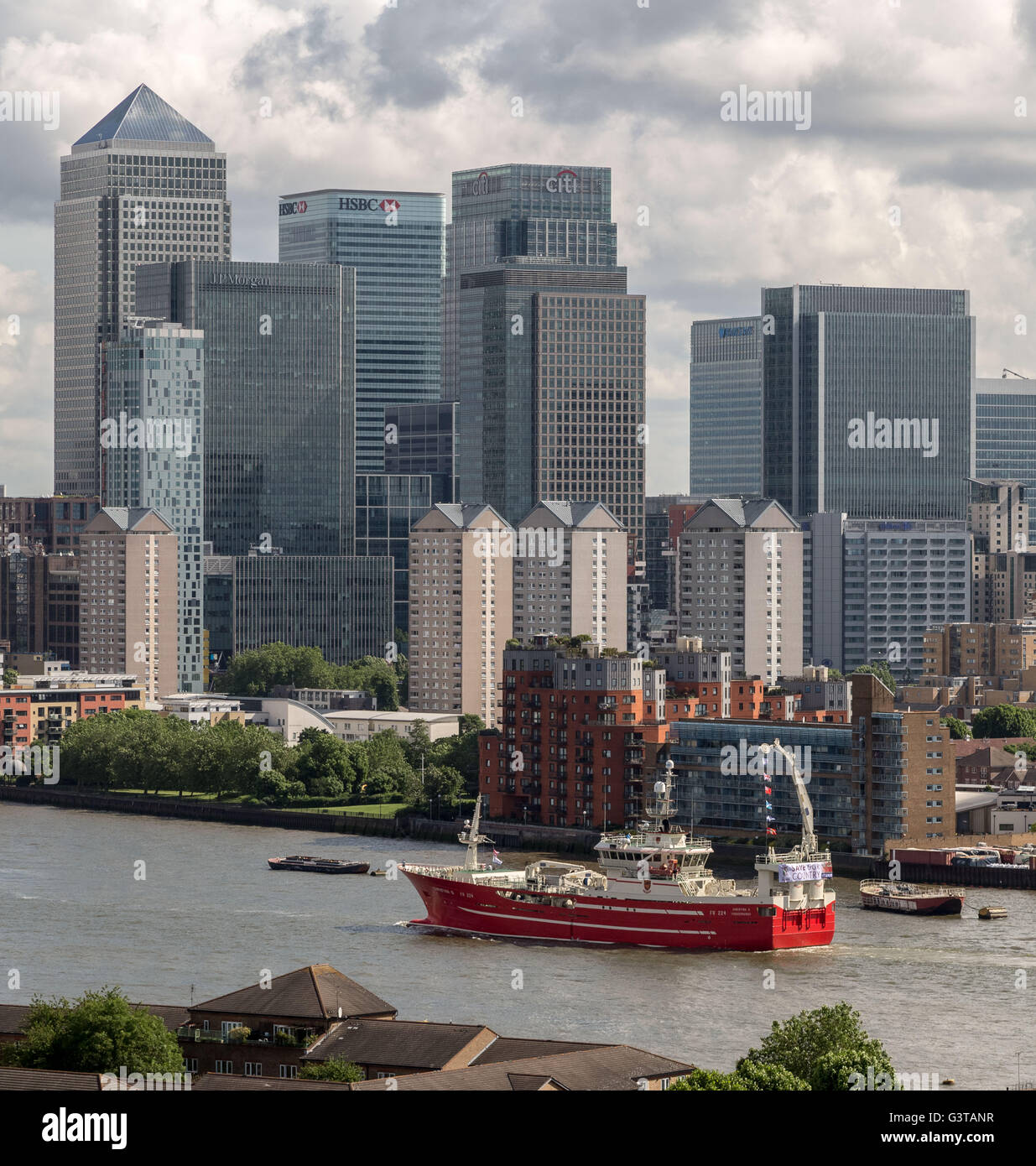 London, UK. 15th June, 2016. Flotilla of British fishermen led by UKIP leader Nigel Farage passes Canary Wharf business park buildings. The flotilla was launched early morning from Southend-on-Sea to highlight the plight of British fishermen and the continued to campaign for Britain to leave the European Union (EU) Credit:  Guy Corbishley/Alamy Live News Stock Photo