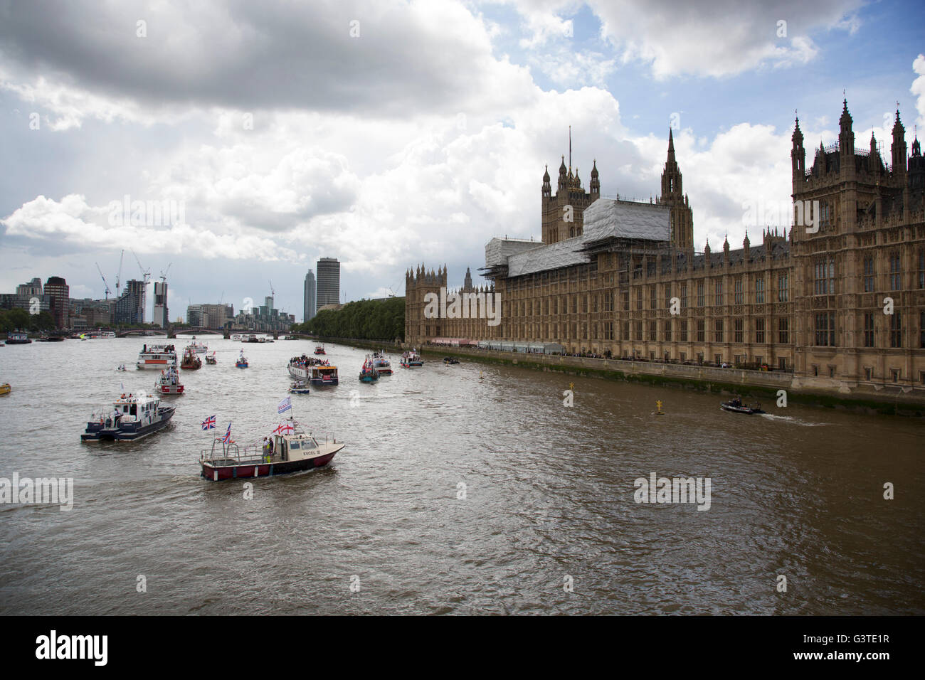 London, UK. 15th June, 2016. Flotilla of fishing vessels on the River Thames arrive outside the Houses of Parliament to make the case for Brexit in the EU Referendum on June 15th in London, United Kingdom. The flotilla was organised by Scottish skippers as part of the Fishing for Leave campaign which is against European regulation of the fishing industry, and the CFP Common Fisheries Policy.   Live News Credit:  Michael Kemp/Alamy Live News Stock Photo