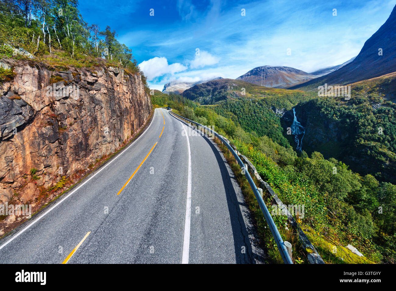 Norway, More og Romsdal, Sunnmore, View of road in mountainous landscape Stock Photo