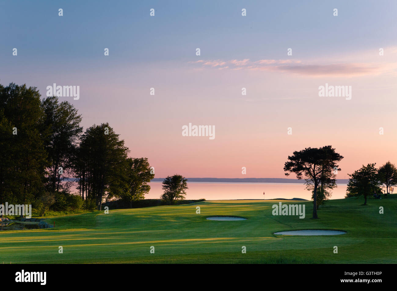 Sweden, Ostergotland, View of Lake Vattern by Ombergs Golf Resort at sunset Stock Photo