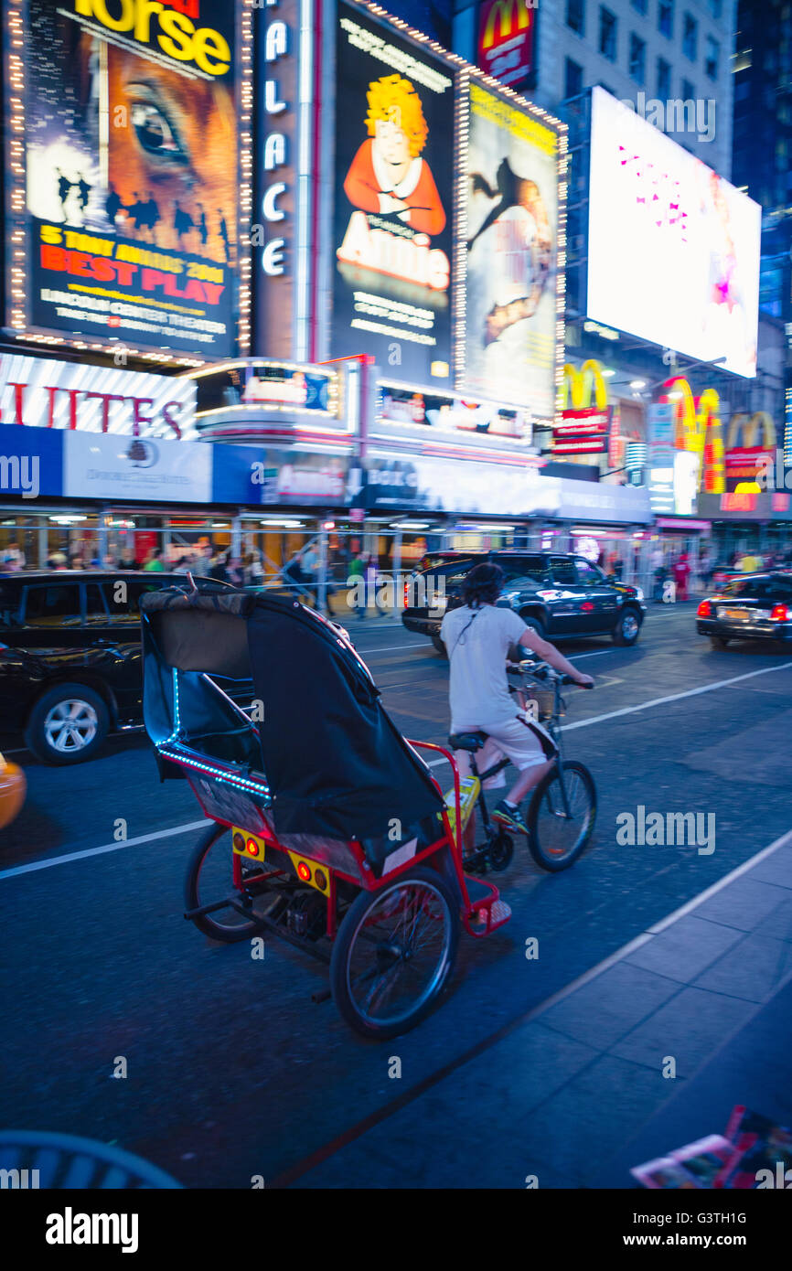 USA, New York State, New York City, Manhattan, Rickshaw in traffic Stock Photo