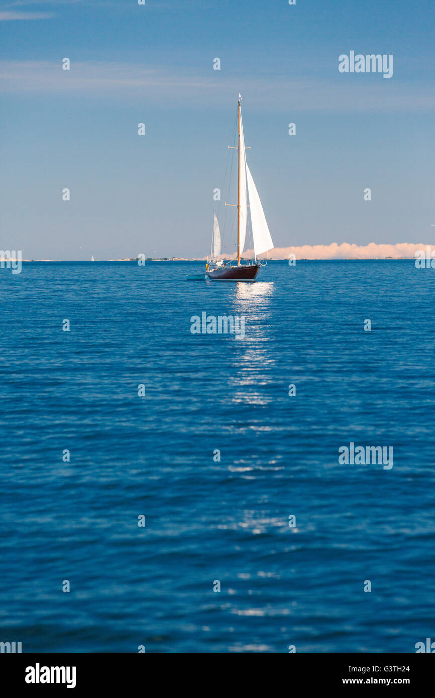Sweden, Pouter Stockholm archipelago, Kapellskar, Man travelling by sailboat on sea Stock Photo