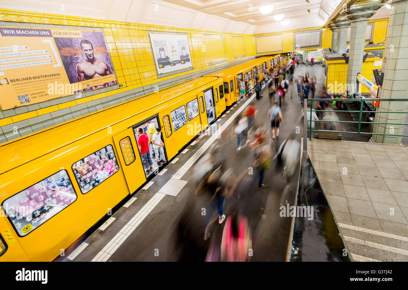 Germany, Berlin, Frankfurter Tor Metro Station, Metro train and moving people Stock Photo