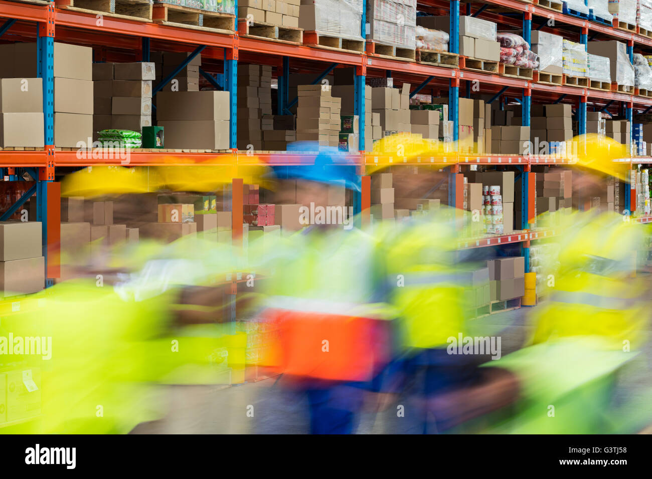 Warehouse workers working together Stock Photo - Alamy