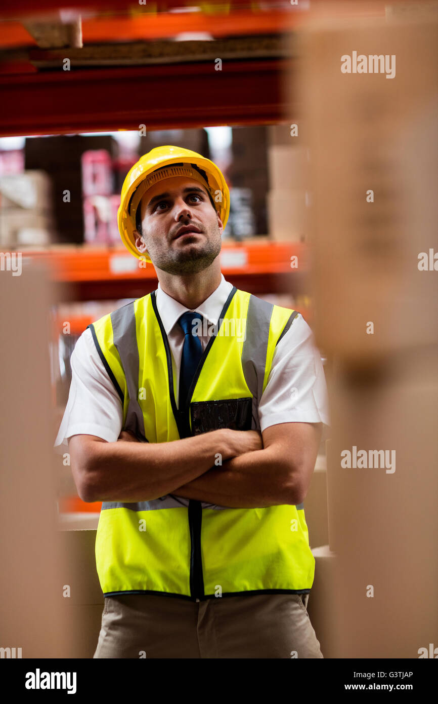 Warehouse manager standing with helmet Stock Photo