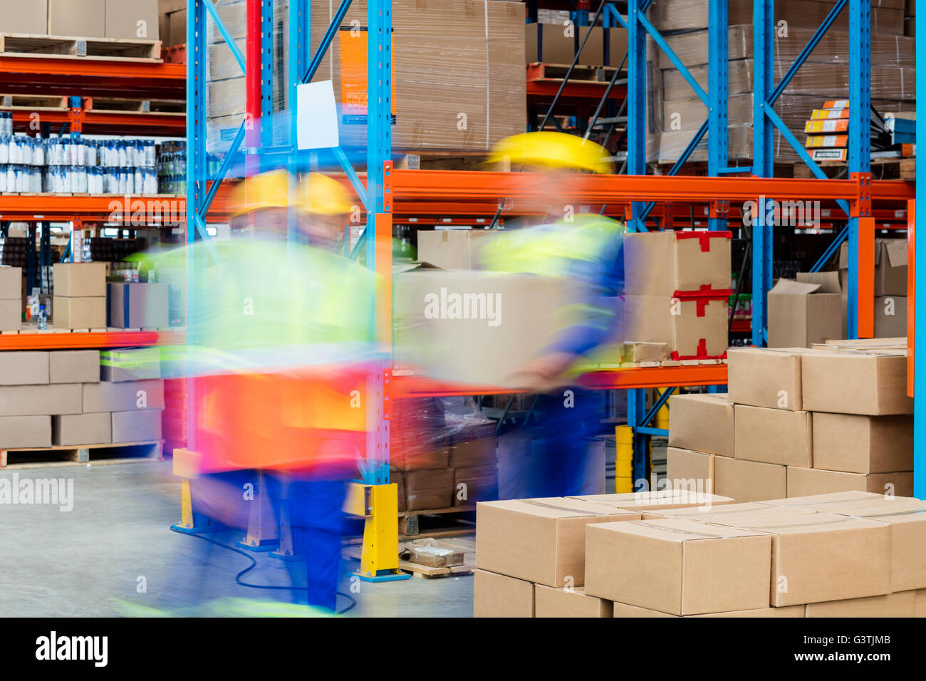 Warehouse workers working together Stock Photo - Alamy