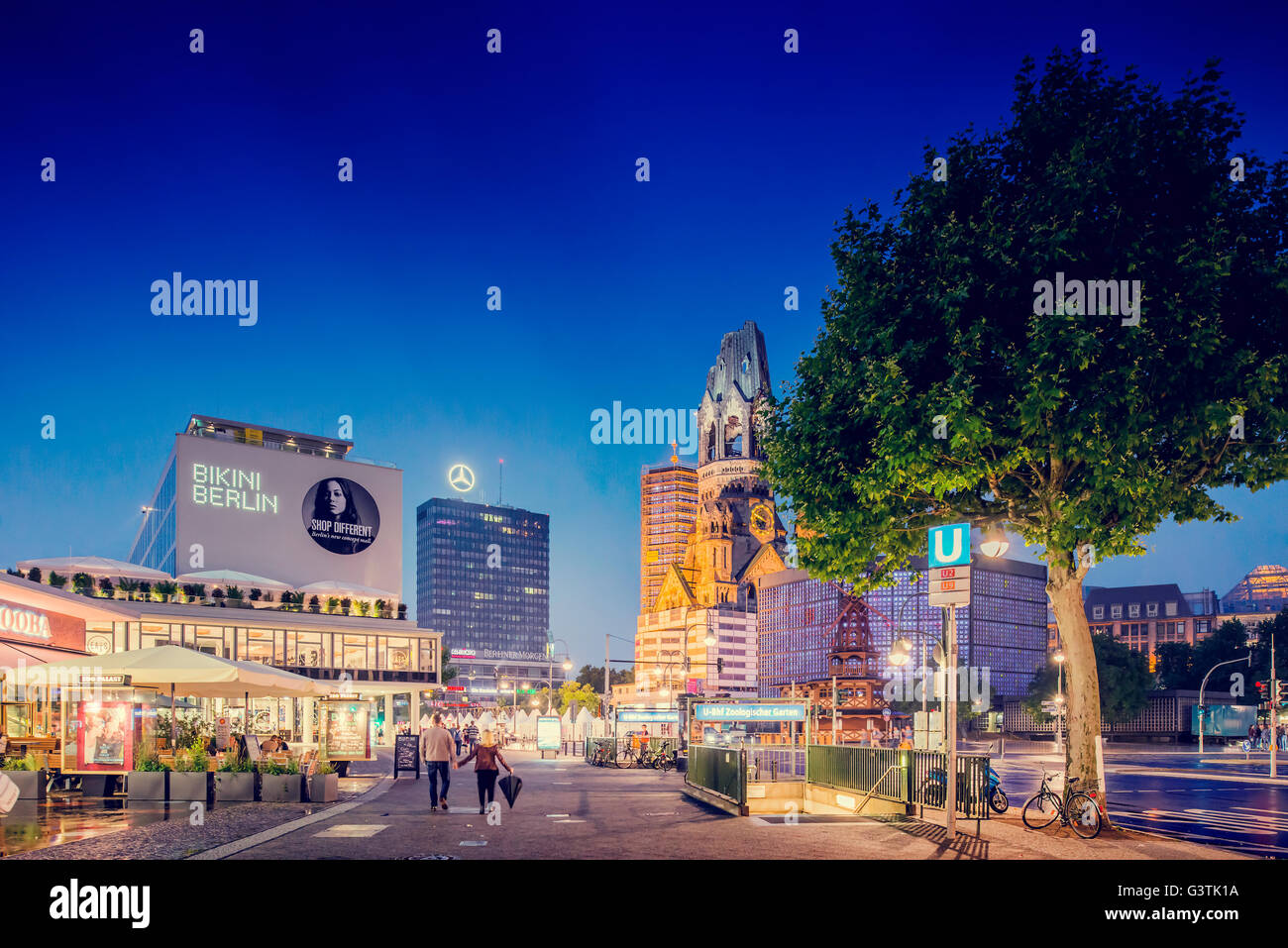 Germany, Berlin, Kurfurstendamm, Street and illuminated skyline Stock Photo